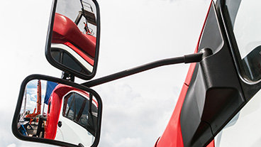 side mirror of a red truck